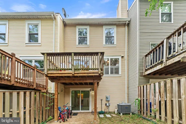 a view of a house with wooden deck