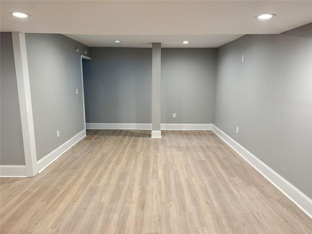 4330 Stonewall Tell Road Atlanta, GA 30349 - Photo 34 of 39 a view of room with wooden floor