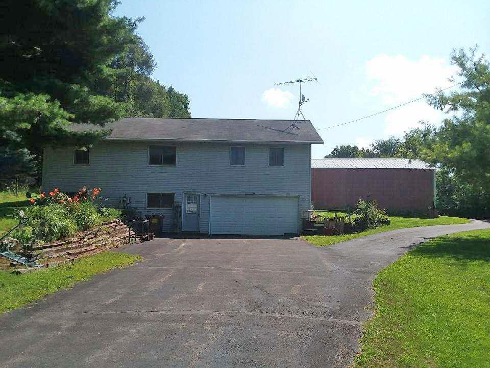 219 North Daysville Road Oregon, IL 61061 - Photo 1 of 23 a front view of a house with a yard and garage