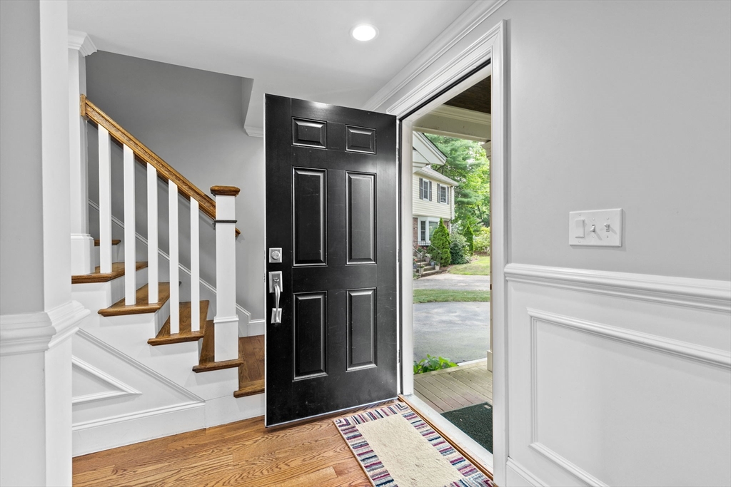 48 Atwill Road Boston, MA 02132 - Photo 15 of 36 a view of entryway with wooden floor and a rug