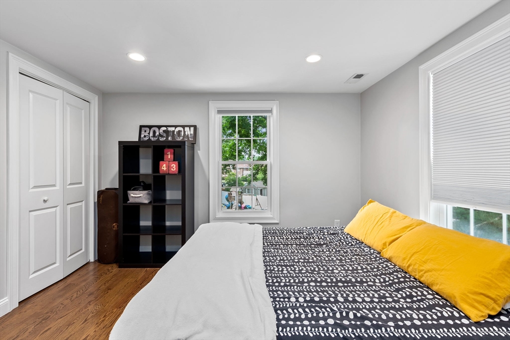 48 Atwill Road Boston, MA 02132 - Photo 24 of 36 a bedroom with a bed and a window