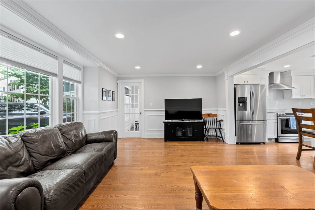 48 Atwill Road Boston, MA 02132 - Photo 3 of 36 a living room with furniture and a flat screen tv