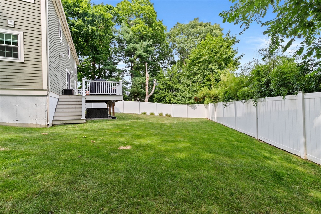 48 Atwill Road Boston, MA 02132 - Photo 33 of 36 a view of a backyard with a garden and entertaining space