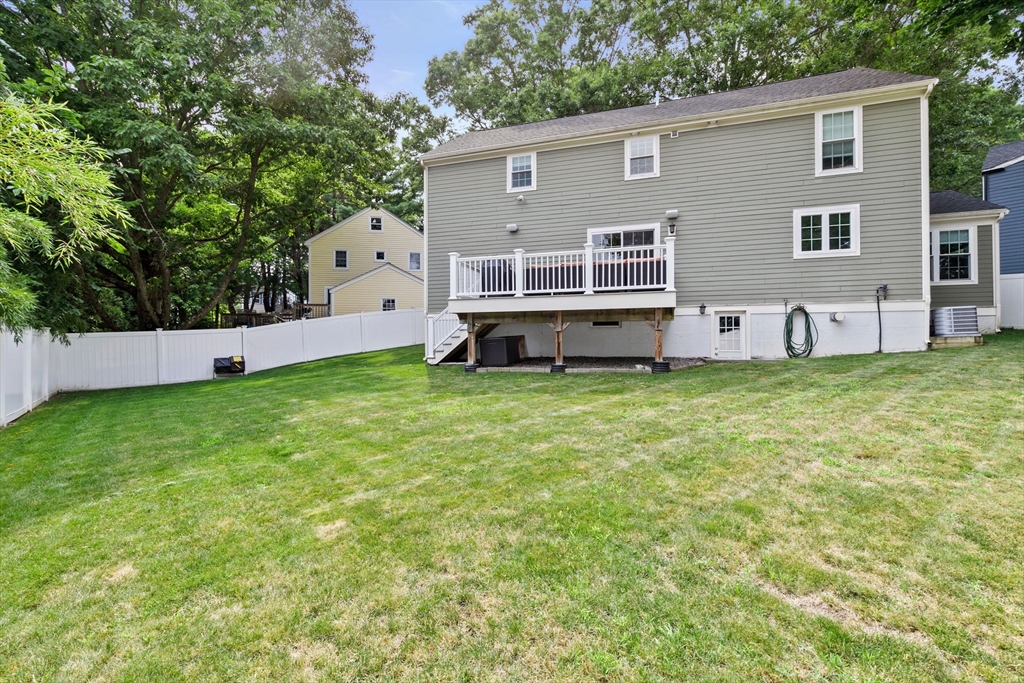 48 Atwill Road Boston, MA 02132 - Photo 35 of 36 a front view of a house with a yard and trees