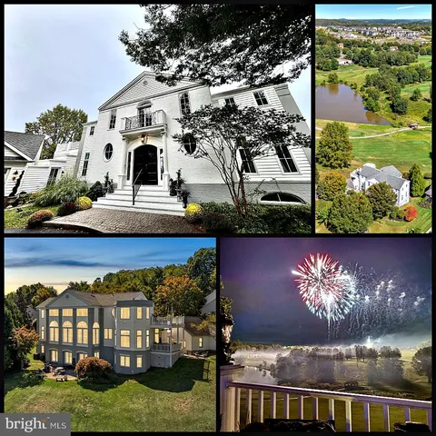 a view of a white house with a big yard and a large tree