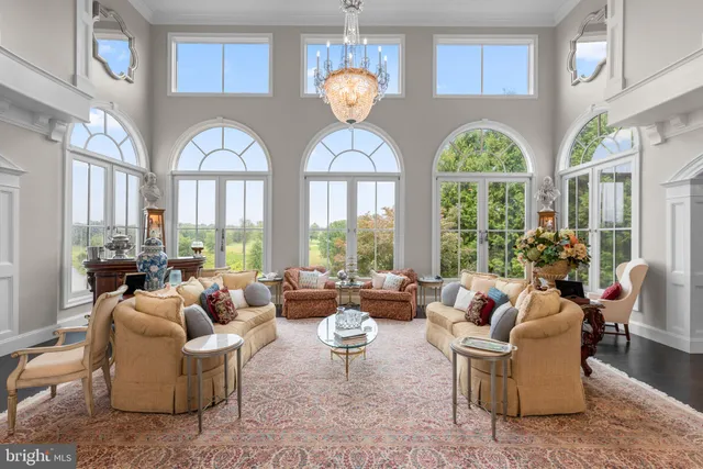 a view of a livingroom with furniture window and wooden floor