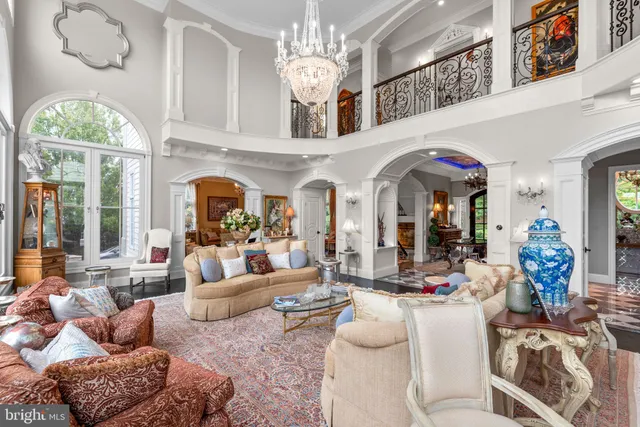 a view of a dining room with furniture a rug and wooden floor