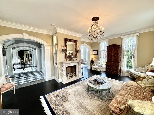 a view of living room with furniture and wooden floor
