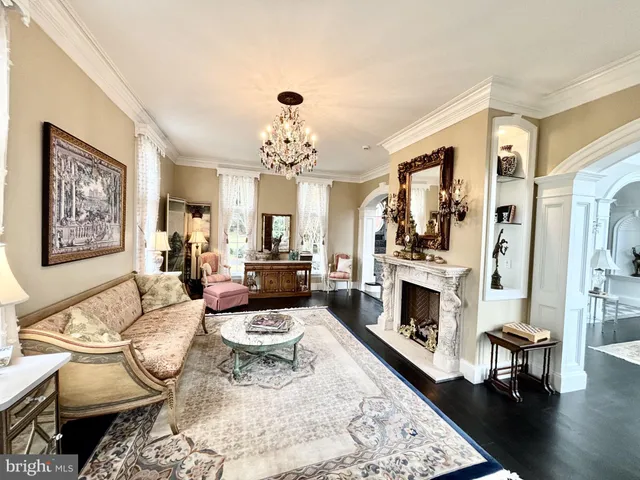 a view of a livingroom with furniture and staircase