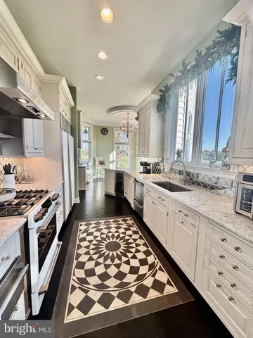 a view of a chairs and table in the balcony