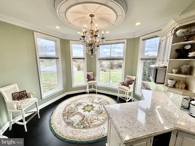 a bedroom with bed and a chandelier