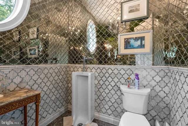 a living room with fireplace furniture and a wooden floor