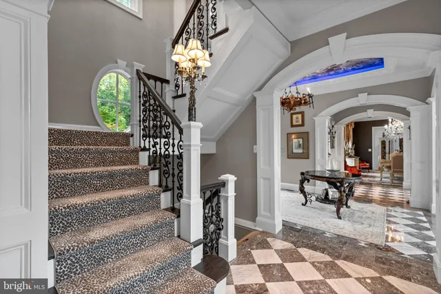 a view of a livingroom with workspace and a window