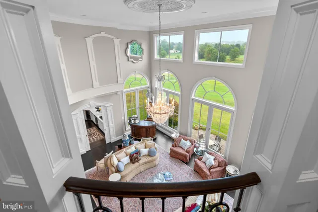 a kitchen with stainless steel appliances granite countertop white cabinets a refrigerator a stove a sink and dishwasher