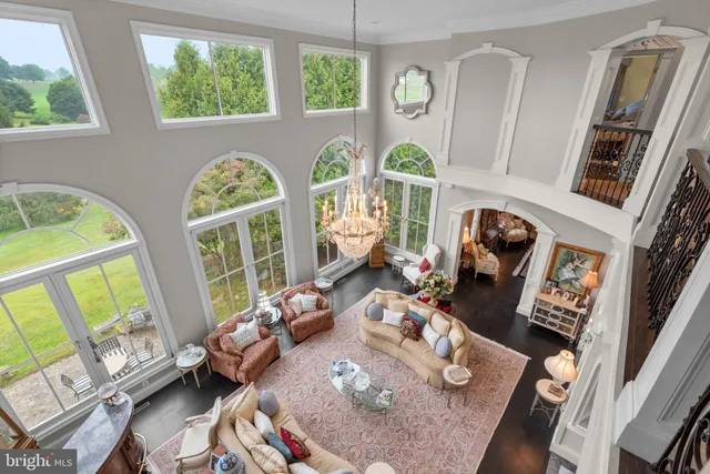 a view of a hallway with a chandelier