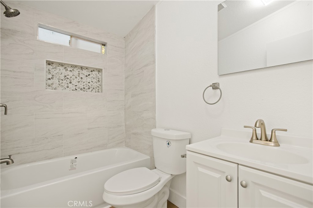 10350 Base Line Road, Unit 128 Rancho Cucamonga, CA 91701 - Photo 18 of 24 a bathroom with a sink a toilet and shower