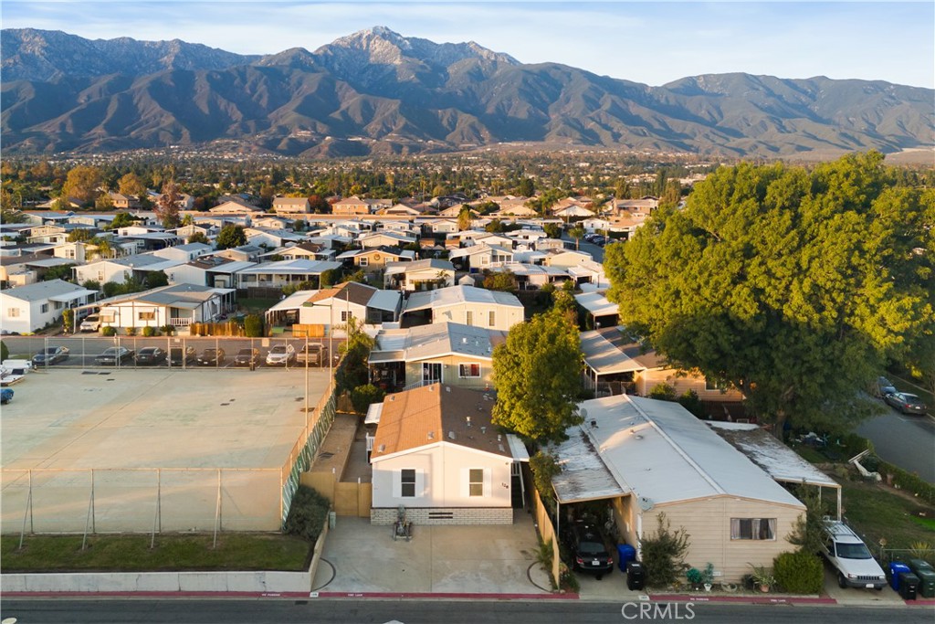 10350 Base Line Road, Unit 128 Rancho Cucamonga, CA 91701 - Photo 4 of 24 an aerial view of residential houses with outdoor space