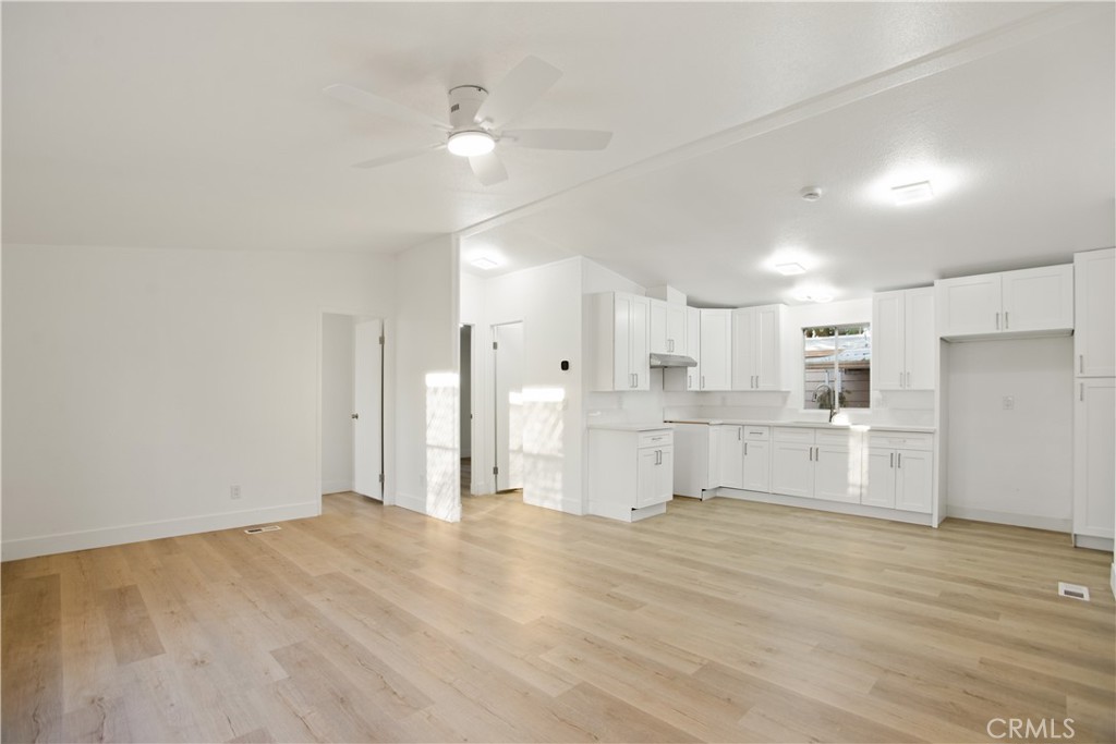 10350 Base Line Road, Unit 128 Rancho Cucamonga, CA 91701 - Photo 9 of 24 a view of kitchen with wooden floor