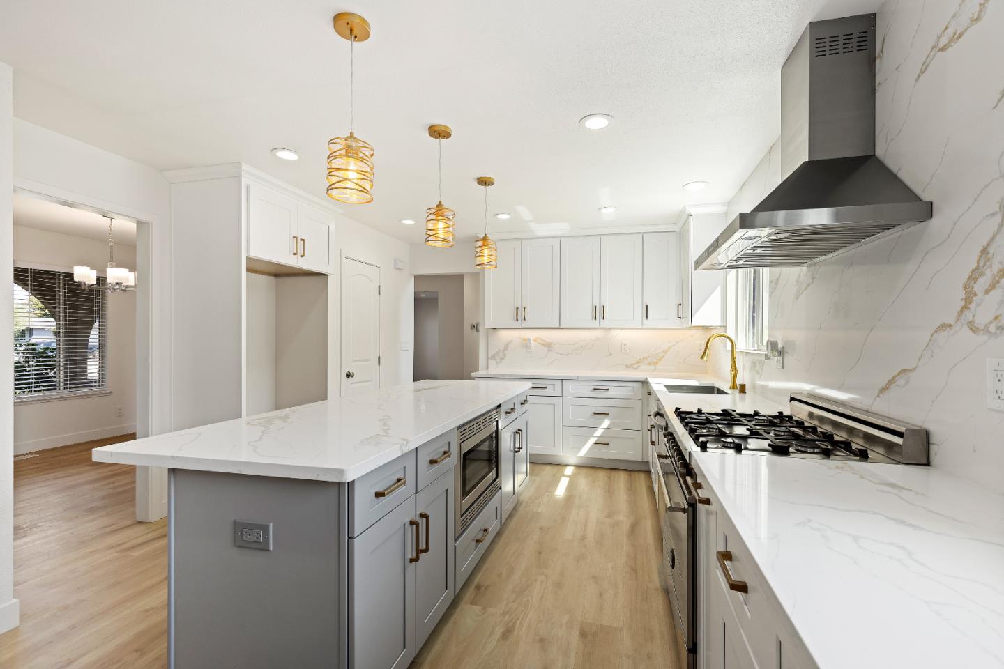 1238 Steven Drive Pittsburg, CA 94565 - Photo 16 of 39 a kitchen with stainless steel appliances a sink a stove a refrigerator and cabinets