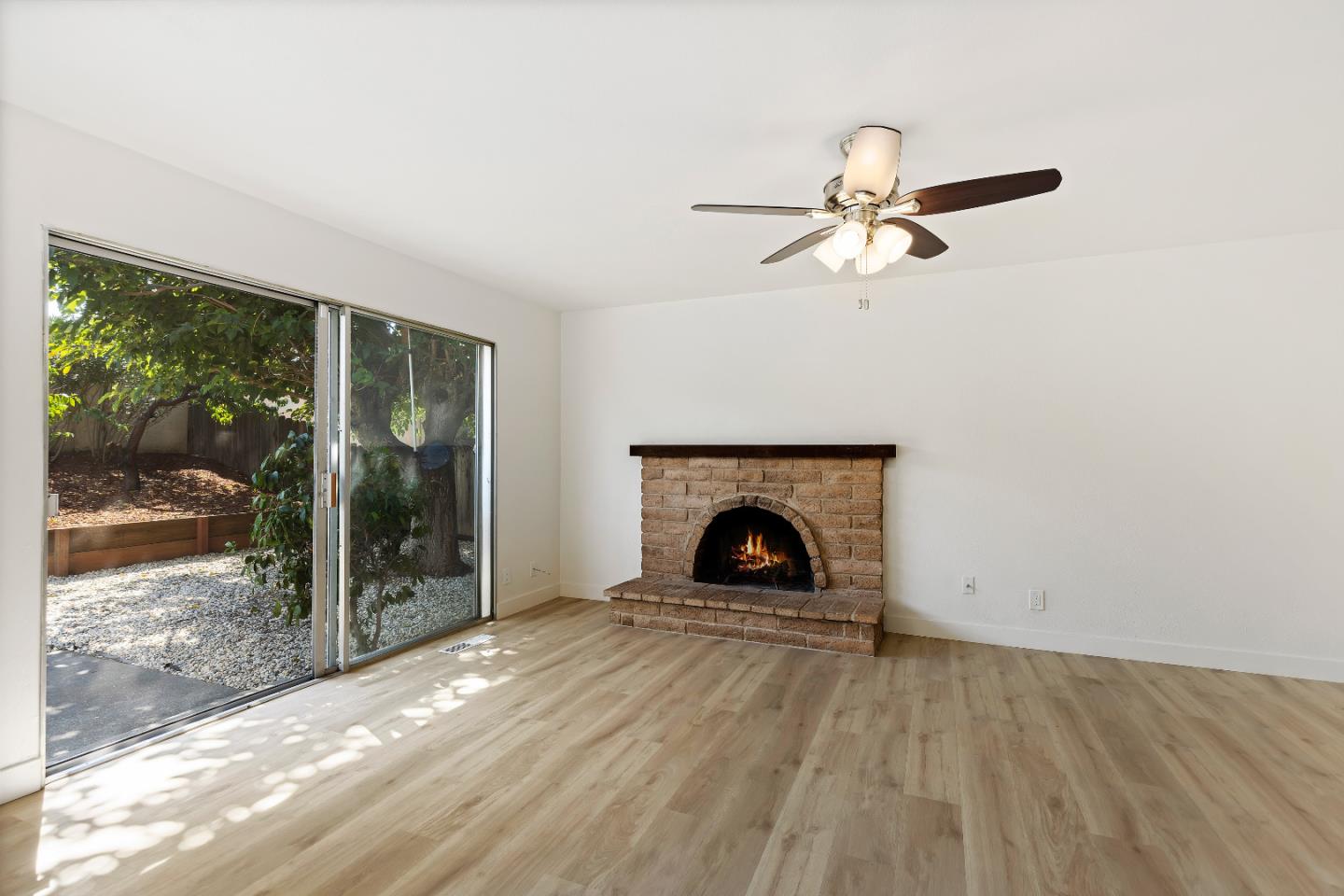 1238 Steven Drive Pittsburg, CA 94565 - Photo 20 of 39 wooden floor in an empty room with a fireplace
