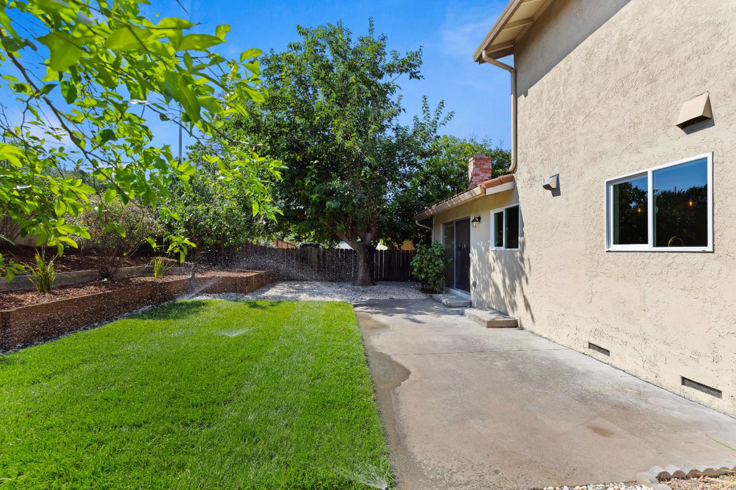 1238 Steven Drive Pittsburg, CA 94565 - Photo 39 of 39 a front view of a house with a yard and a garden