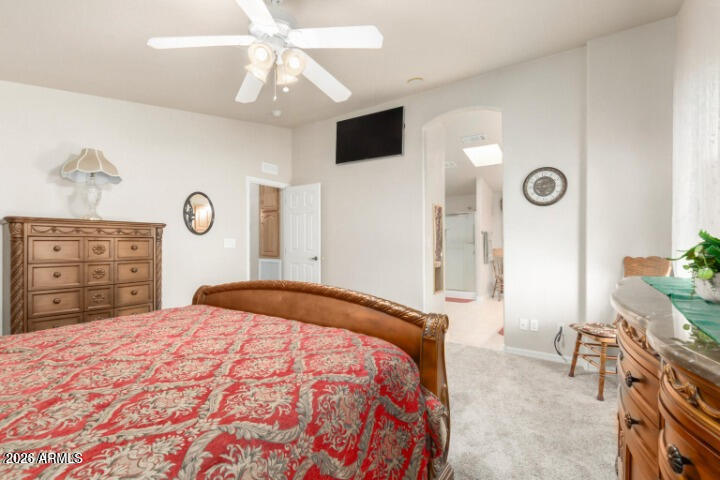 3301 South Goldfield Road, Unit 4086 Apache Junction, AZ 85119 - Photo 9 of 41 a bedroom with a bed and a dresser