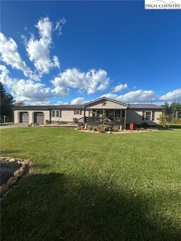 a view of house with garden