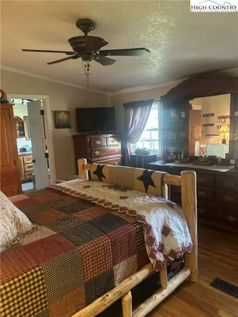 a bedroom with a bed and window