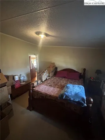 a view of a house with backyard and porch