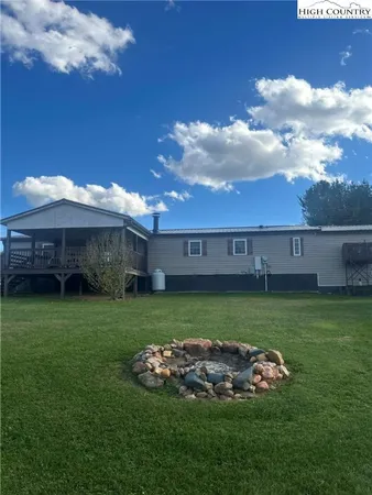 a view of a house with a back yard