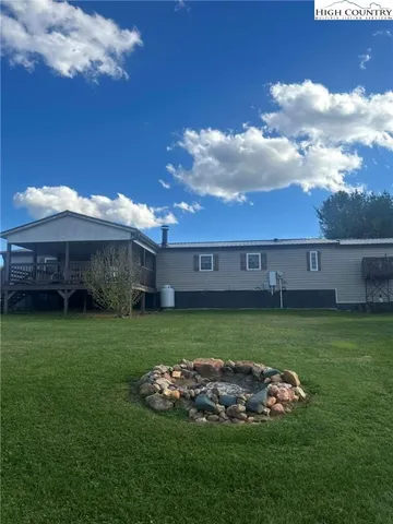 a view of a house with a back yard