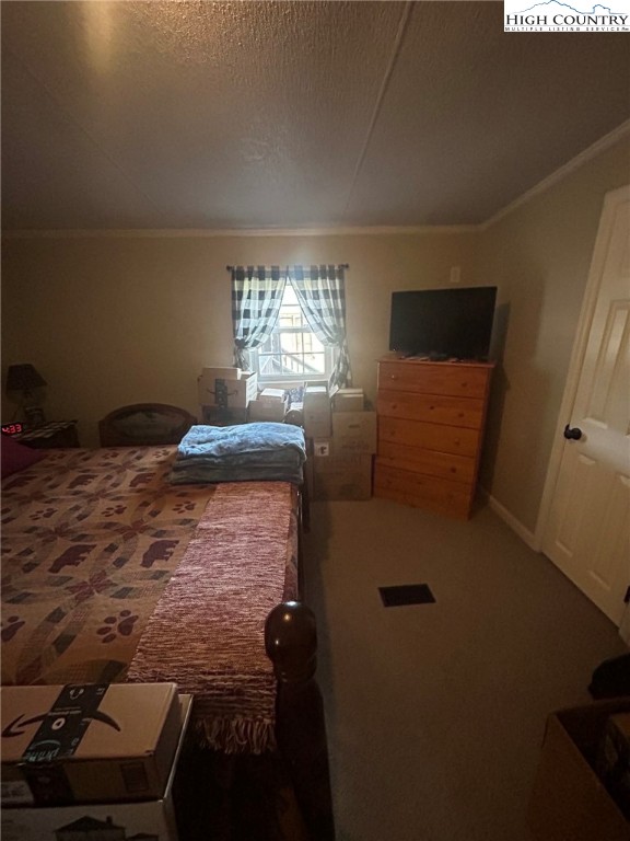 480 Fraser Road Sparta, NC 28675 - Photo 31 of 36 a bedroom with a bed and a window