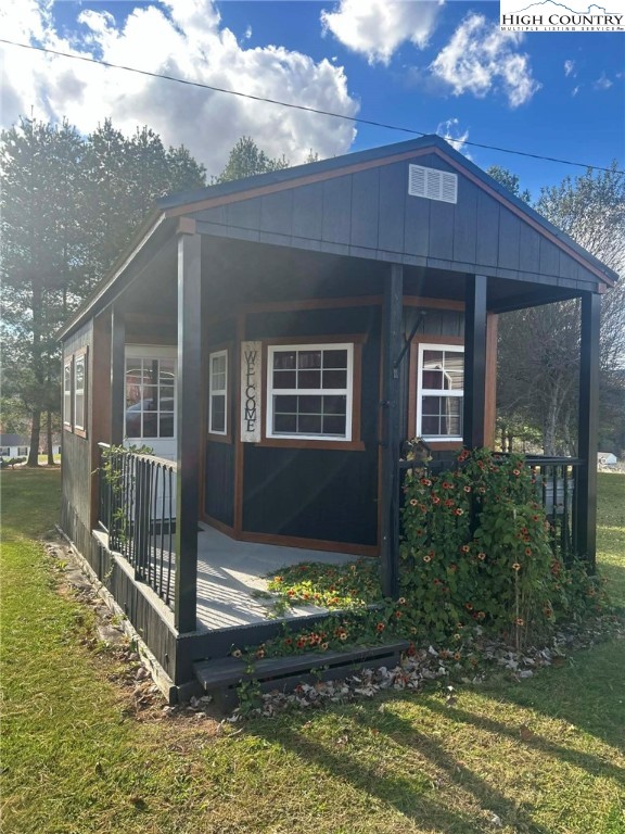 480 Fraser Road Sparta, NC 28675 - Photo 36 of 36 a front view of a house with a yard