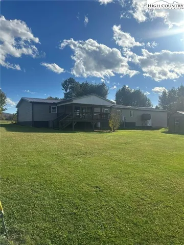 a kitchen with a sink a counter top space appliances and cabinets