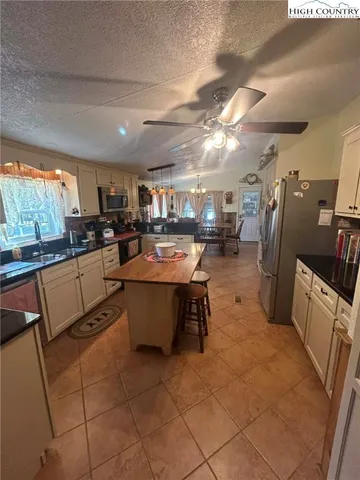 a room with furniture pool table and windows