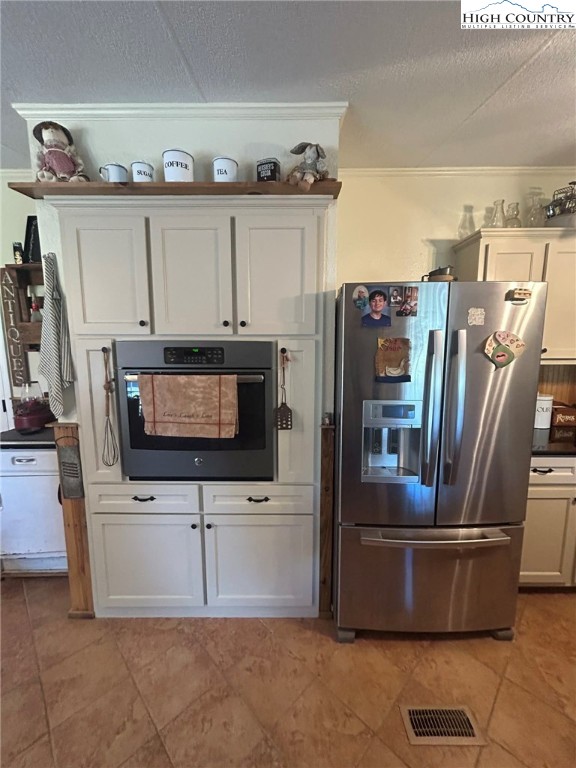 480 Fraser Road Sparta, NC 28675 - Photo 8 of 36 a kitchen with stainless steel appliances a refrigerator a stove a microwave a sink and dishwasher