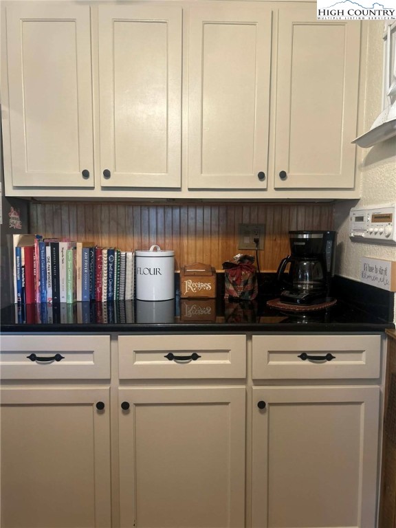 480 Fraser Road Sparta, NC 28675 - Photo 9 of 36 a kitchen with white cabinets and white appliances