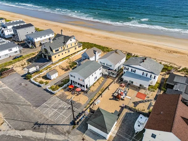 an aerial view of a house with outdoor space