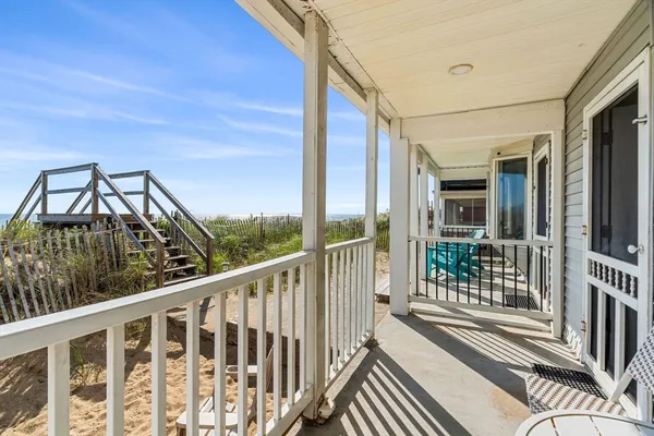 a view of a kitchen with cabinets washer and dryer