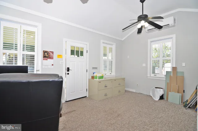 a bathroom with a toilet a sink and a window