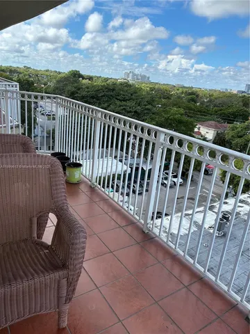 a view of balcony with furniture