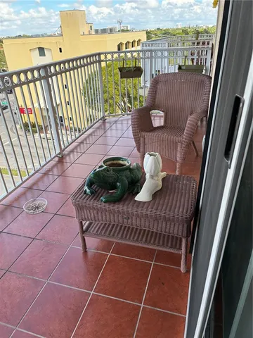 a view of a balcony with wooden floor