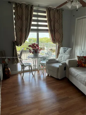 a spacious bathroom with a double vanity sink toilet mirror and shower
