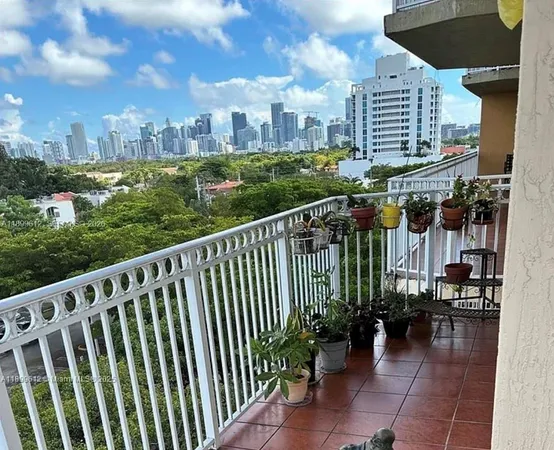 a kitchen with a sink a stove and a microwave