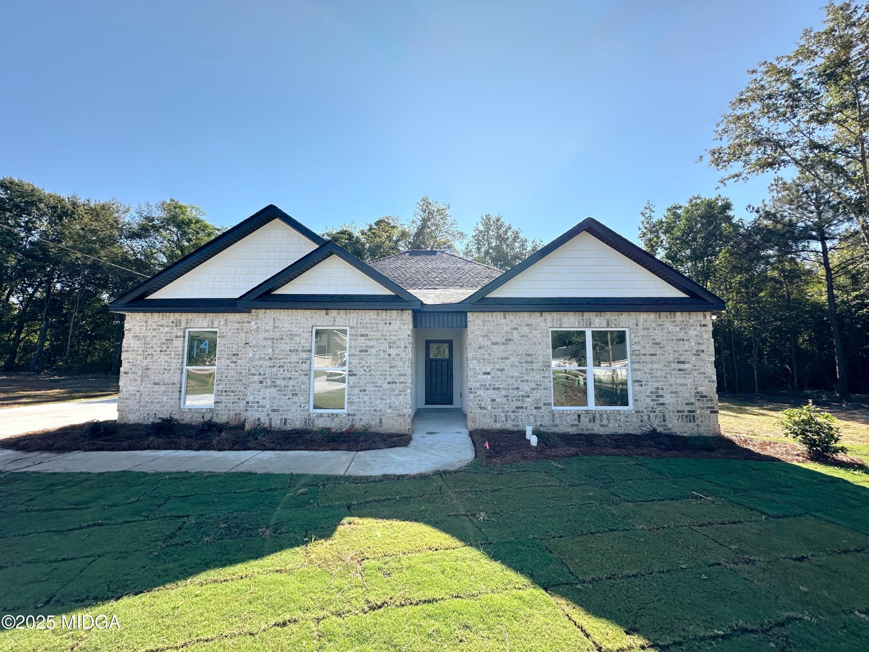 front view of a house with a yard