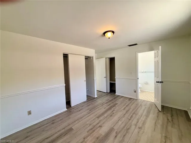a bathroom with a window and a shower