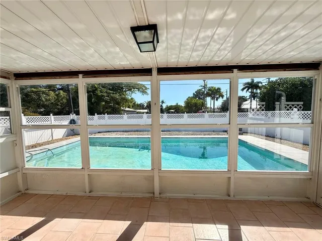 a house view with a sitting space and garden