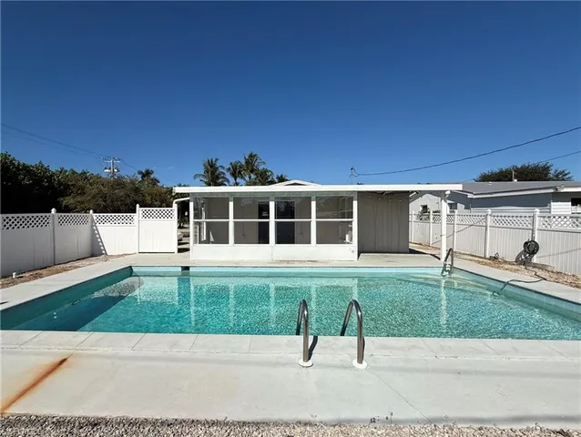 a view of a house with swimming pool