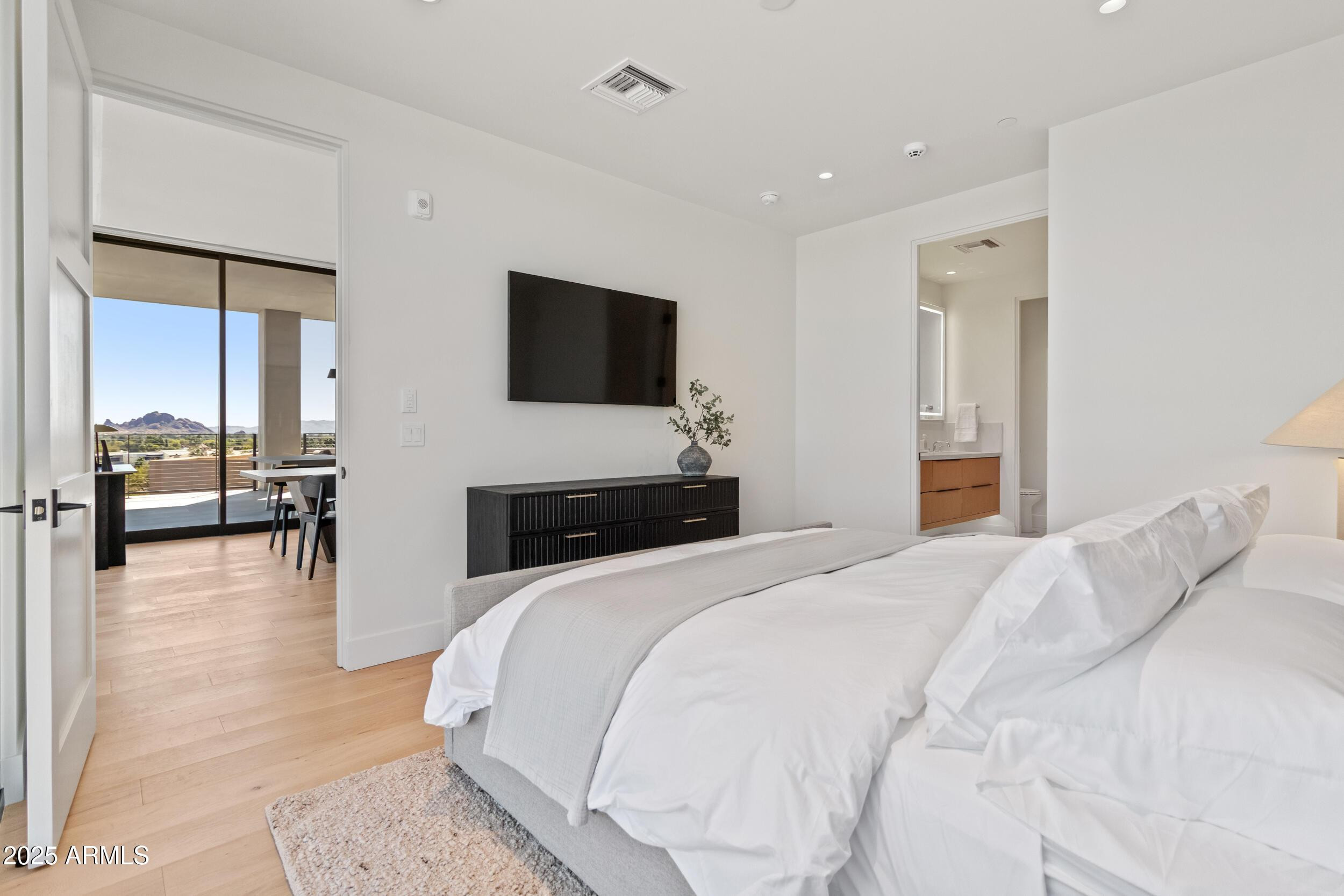 5000 North Camelback Ridge Drive, Unit 302 Scottsdale, AZ 85251 - Photo 19 of 42 a bedroom with a bed and a flat screen tv