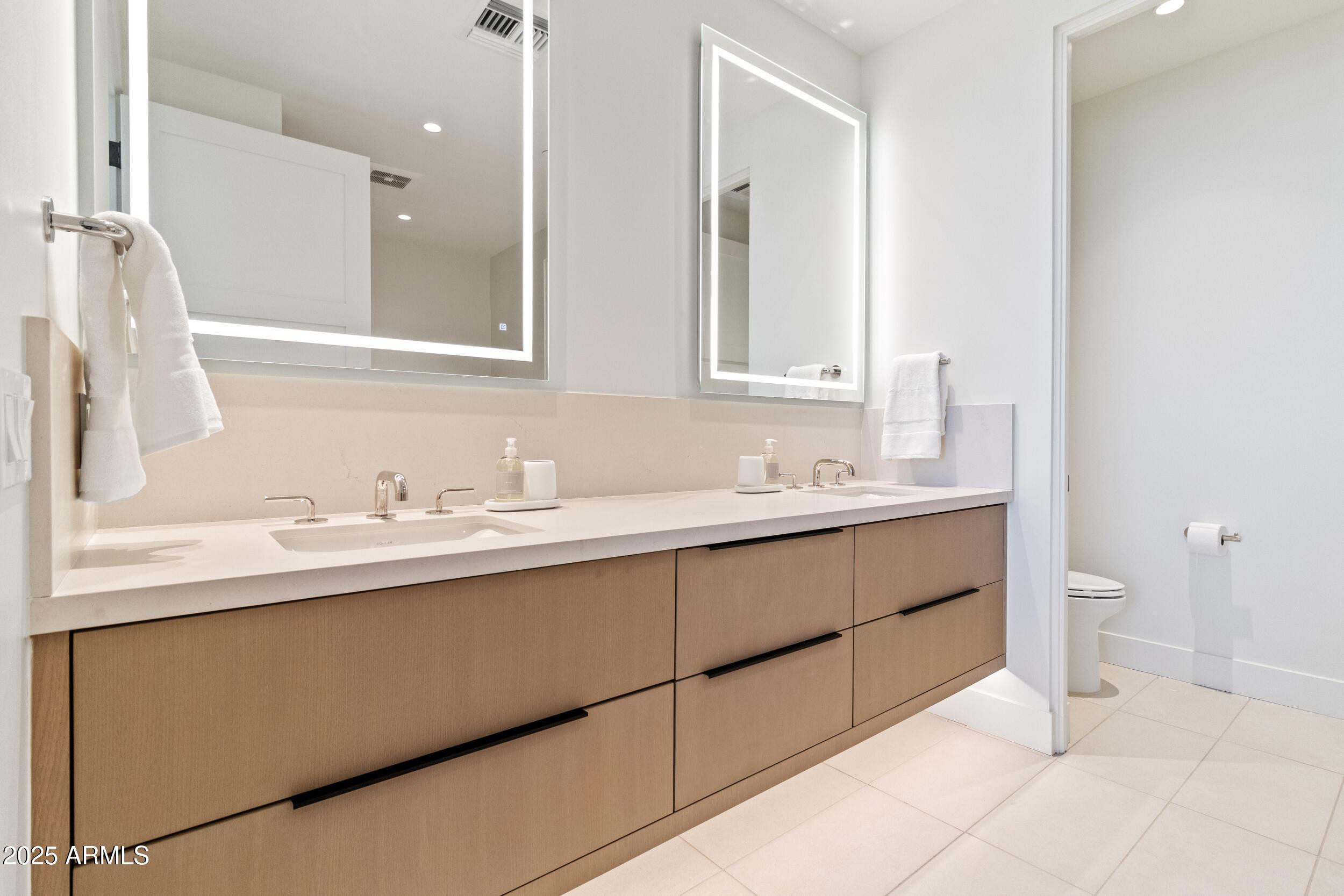 5000 North Camelback Ridge Drive, Unit 302 Scottsdale, AZ 85251 - Photo 20 of 42 a bathroom with a sink and a toilet